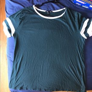Dark green t shirt with white stripes on sleeves